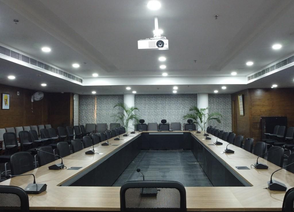 Professional boardroom with U-shaped seating arrangement